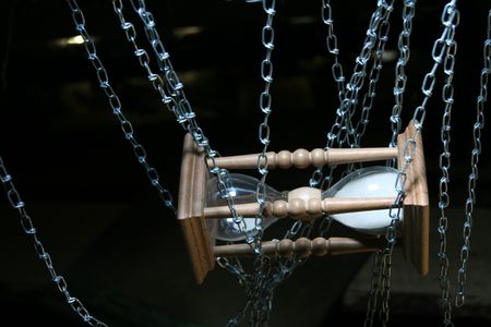 The hours held down by a chain have stopped time