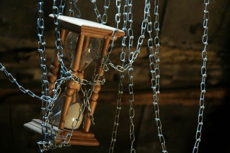 The hours held down by a chain have stopped timeの写真素材