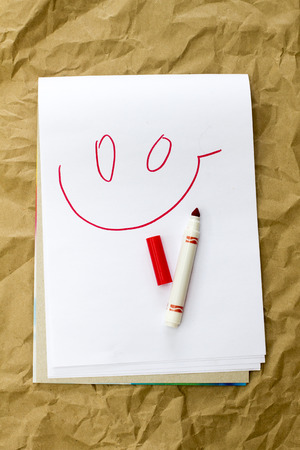 on paper painted smiley red felt-tip penの写真素材