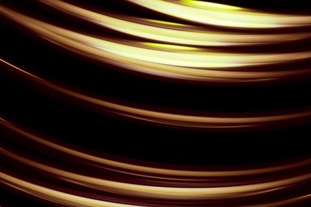 Golden light trails texture on dark backgroundの写真素材
