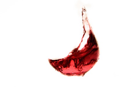 Agitated wine in a glass like shapeの写真素材