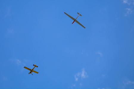 Trailed glider being leaved in the sky. Optimal altitude.の写真素材