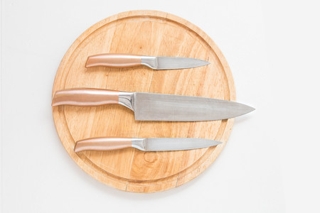 Proffessional chef knifes on the cutting table. Meal preparation.の写真素材