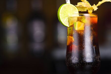 Brown cocktail on the bar tender. Cocktail servedの写真素材