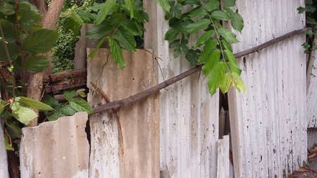 broken fence made from carved tileの写真素材