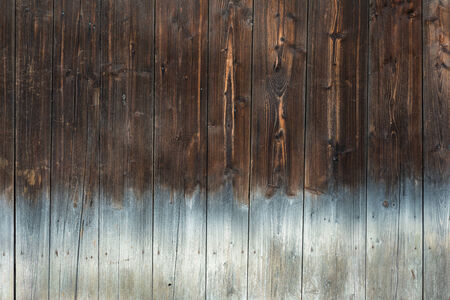 brown wood texture background with light bottomの写真素材