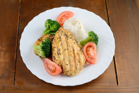 grilled chicken breast with rice and vegetablesの写真素材