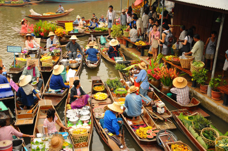 Amphawa, Thailand , Jan 21, 2010 - Boats loaded with fruits and vegetables in Amphawa Floating Market , Amphawa , Thailand. Amphawa, Thailand , Jan 21, 2010 - Boats loaded with fruits and vegetables in Amphawa Floating Market , Amphawa , Thailand.