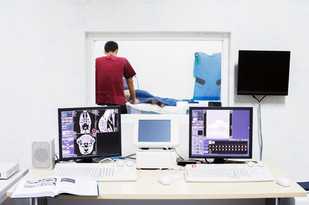 veterinarian assistant working in CT scanner roomの写真素材