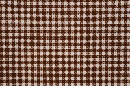 brown and white gingham cloth background with fabric texture.