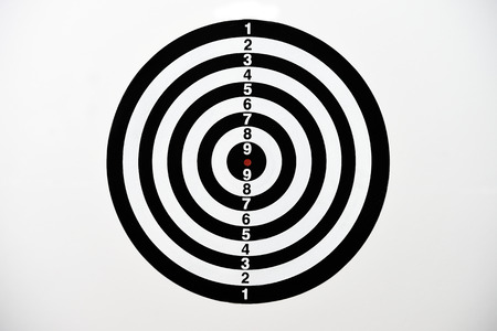 Black and white dart board with numbering score isolated on white background.の写真素材