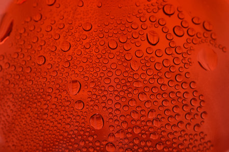 close up shot of water drops on glass surface as background.の写真素材