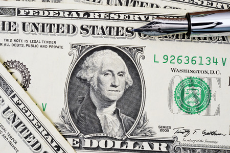 Close up of one dollar and pen for background.
