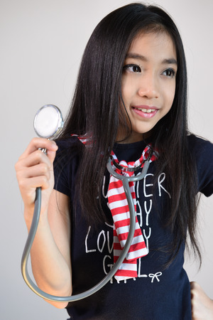 Little girl with stethoscopeの写真素材