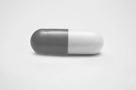 closeup of medical capsules isolated on white backgroundの写真素材