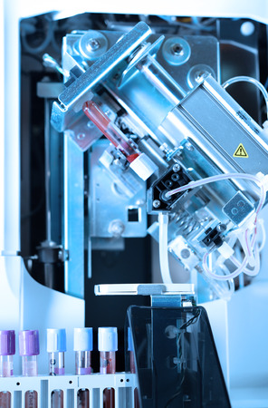 close up shot of blood test machine in laboratory take with blue filterの写真素材