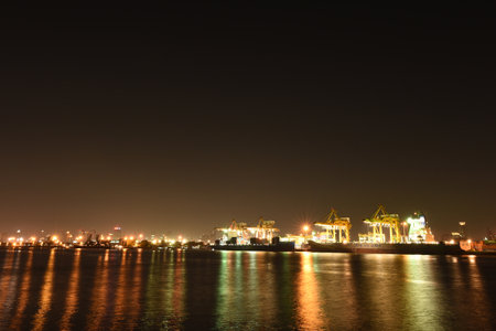 BANGKOK, February 26,2015: Port Authority of Thailand Klongtoey. The biggest port in Bangkok with loaded freight ship and cargo handling equipment on the side of Chao Phraya river. Bangkok,Thailand.のeditorial素材