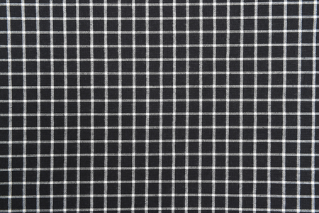 black and white gingham cloth background with fabric texture.