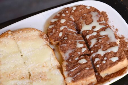 Bread with chocolate and butter toast in plateの写真素材