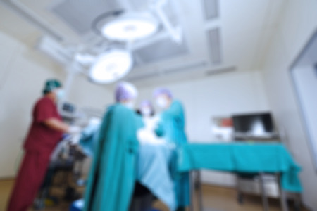 Blur of group of veterinarian surgery in operation roomの写真素材