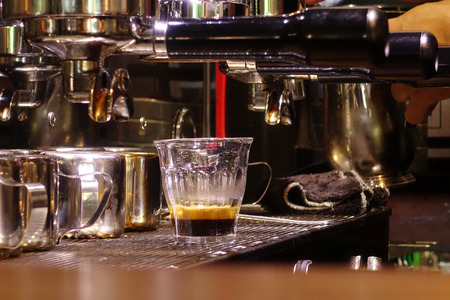 coffee machine preparing cup of coffee.の写真素材