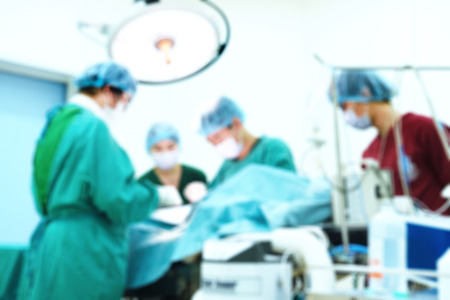 Blur of group of veterinarian surgery in operation roomの写真素材