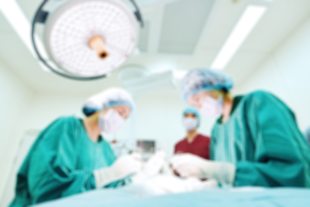 Blur of group of veterinarian surgery in operation roomの写真素材