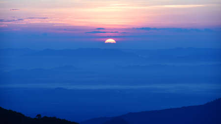 Colorful sunset over the mountainの写真素材