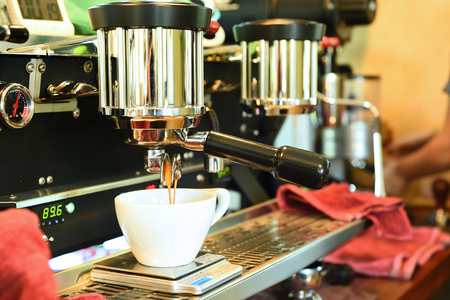 coffee machine preparing cup of coffee.の写真素材