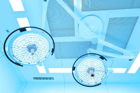 Two surgical lamps in operation room take with art lighting and blue filterの写真素材