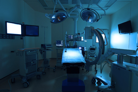 equipment and medical devices in modern operating room take with art lighting and blue filter