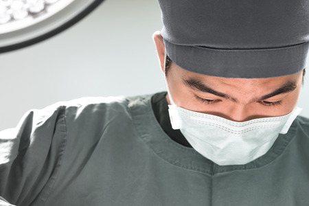 veterinarian surgery in operation room take with selective color technique and art lightingの写真素材