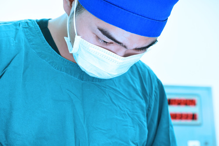 veterinarian surgery in operation room take with art lighting and blue filter