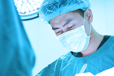 veterinarian surgery in operation room take with art lighting and blue filterの写真素材