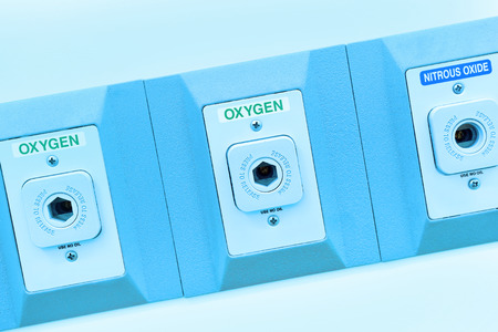 oxygen outlet in operating room take with art lighting and blue filterの写真素材
