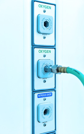 oxygen outlet in operating room take with art lighting and blue filterの写真素材