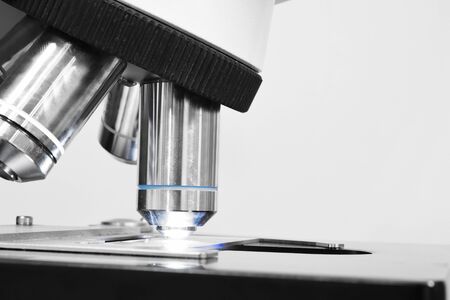 close up shot of microscope at the blood laboratory take with selective color technique and art lightingの写真素材