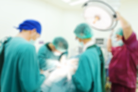 Blur of group of veterinarian surgery in operation roomの写真素材