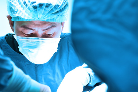 veterinarian surgery in operation room take with art lighting and blue filterの写真素材