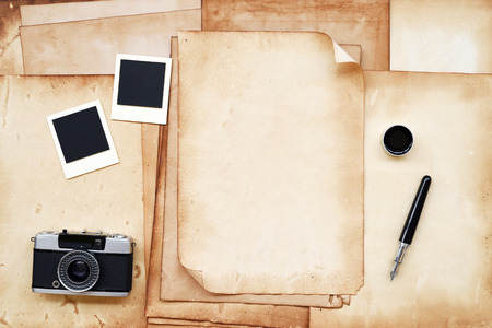 Old paper and pen, camera with frame and ink for backgroundの写真素材