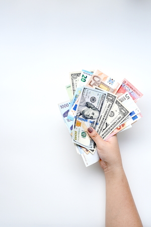 Banknote on hand isolated on white backgroundの写真素材