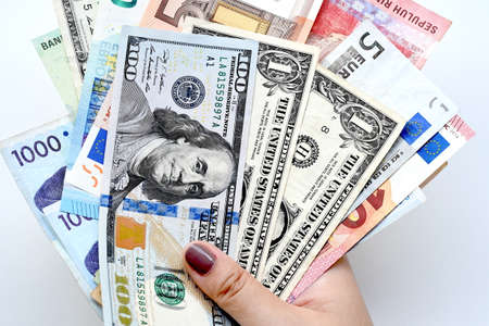 Banknote on hand isolated on white backgroundの写真素材