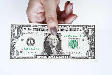 Dollars bill on hand isolated on white backgroundの写真素材