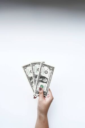 Dollars bill on hand isolated on white background