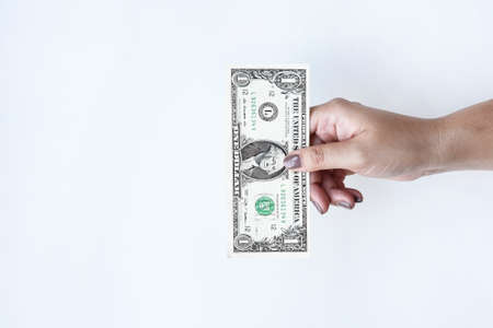 Dollars bill on hand isolated on white backgroundの写真素材