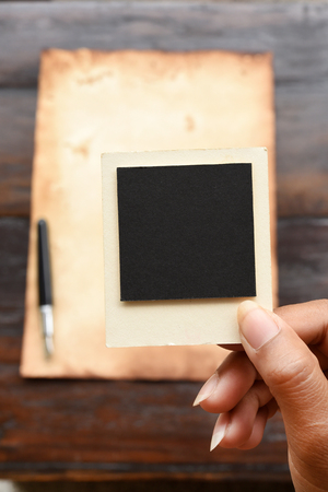 Old paper and pen with photo frame for backgroundの写真素材