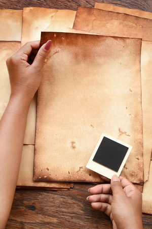 Old paper and photo frames for backgroundの写真素材