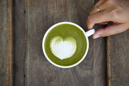 A cup of green tea matcha latteの写真素材