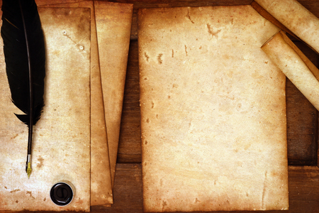 old paper with feather and ink on wooden backgroundの写真素材