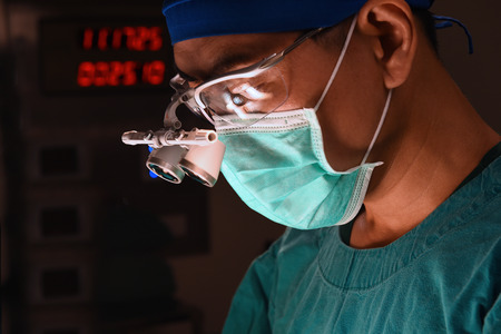 veterinarian surgeons in operating roomの写真素材